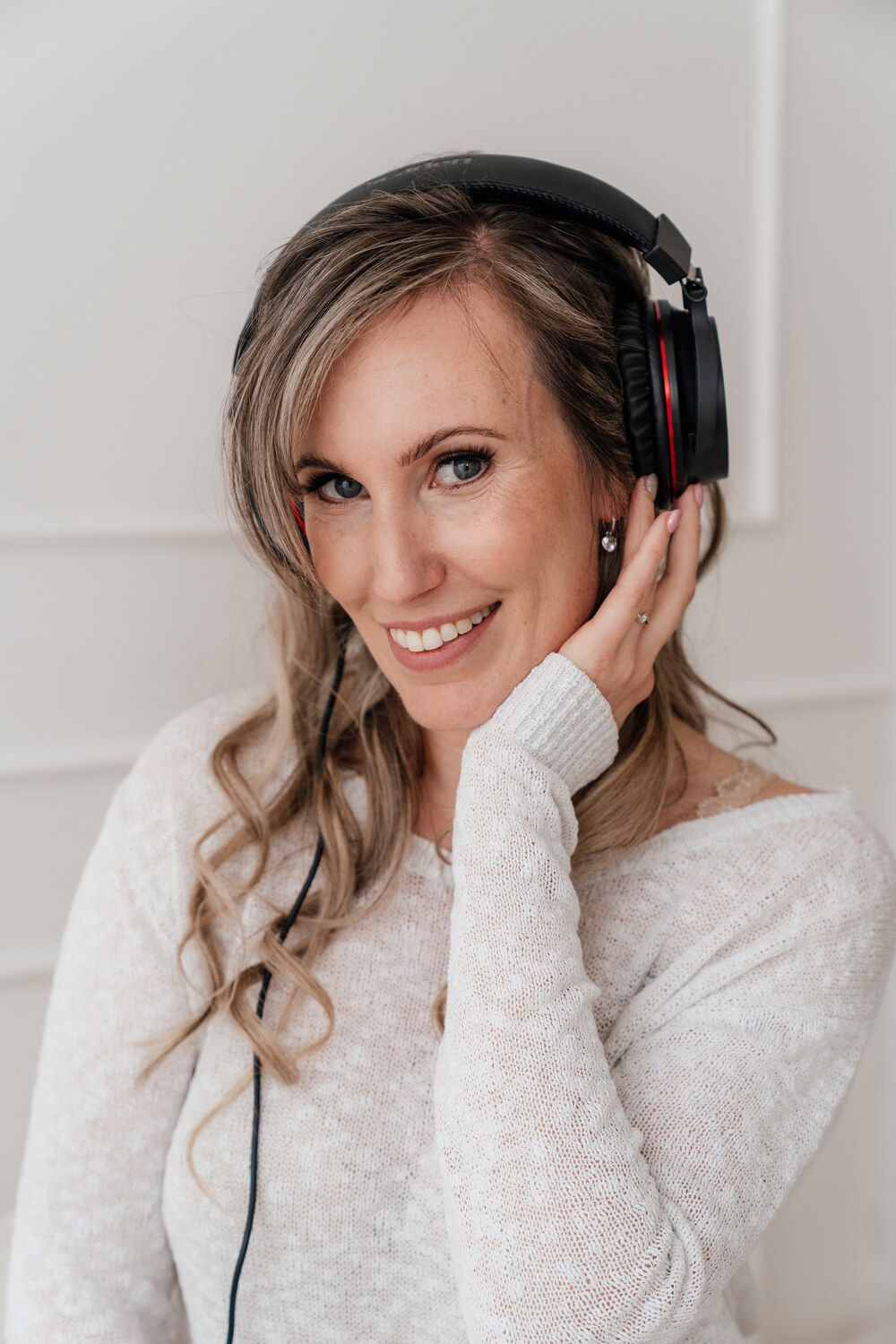 Female Dutch voice actress with headphones recording voice-over