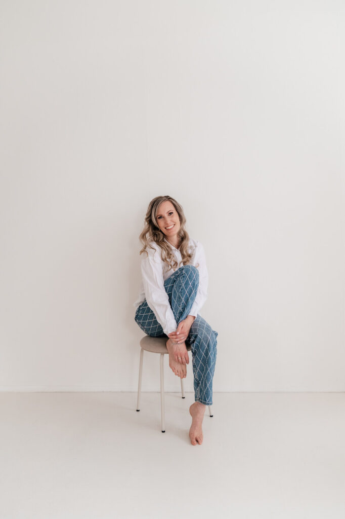 Voice actress Kirsten van Stenis sitting on chair